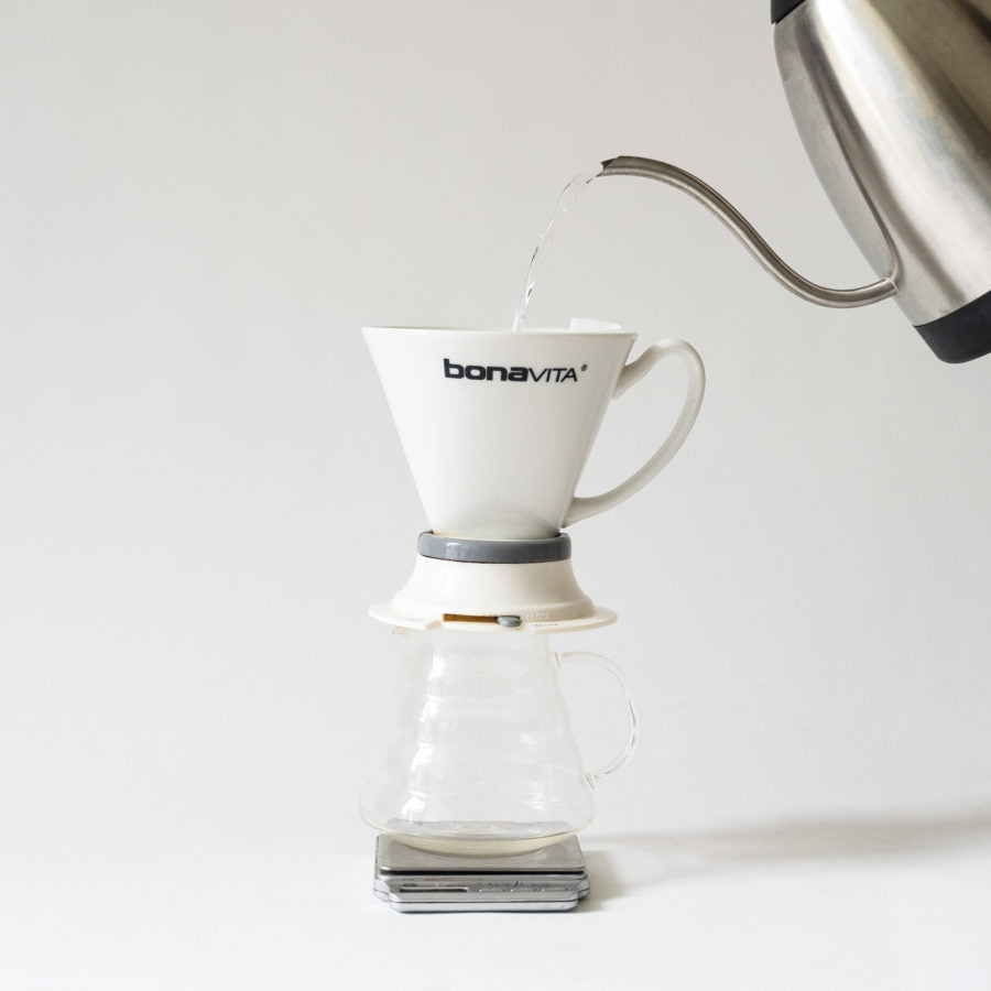 A pouring water into a cup