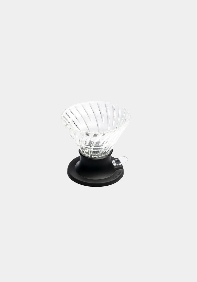 Clear glass coffee dripper on a white background