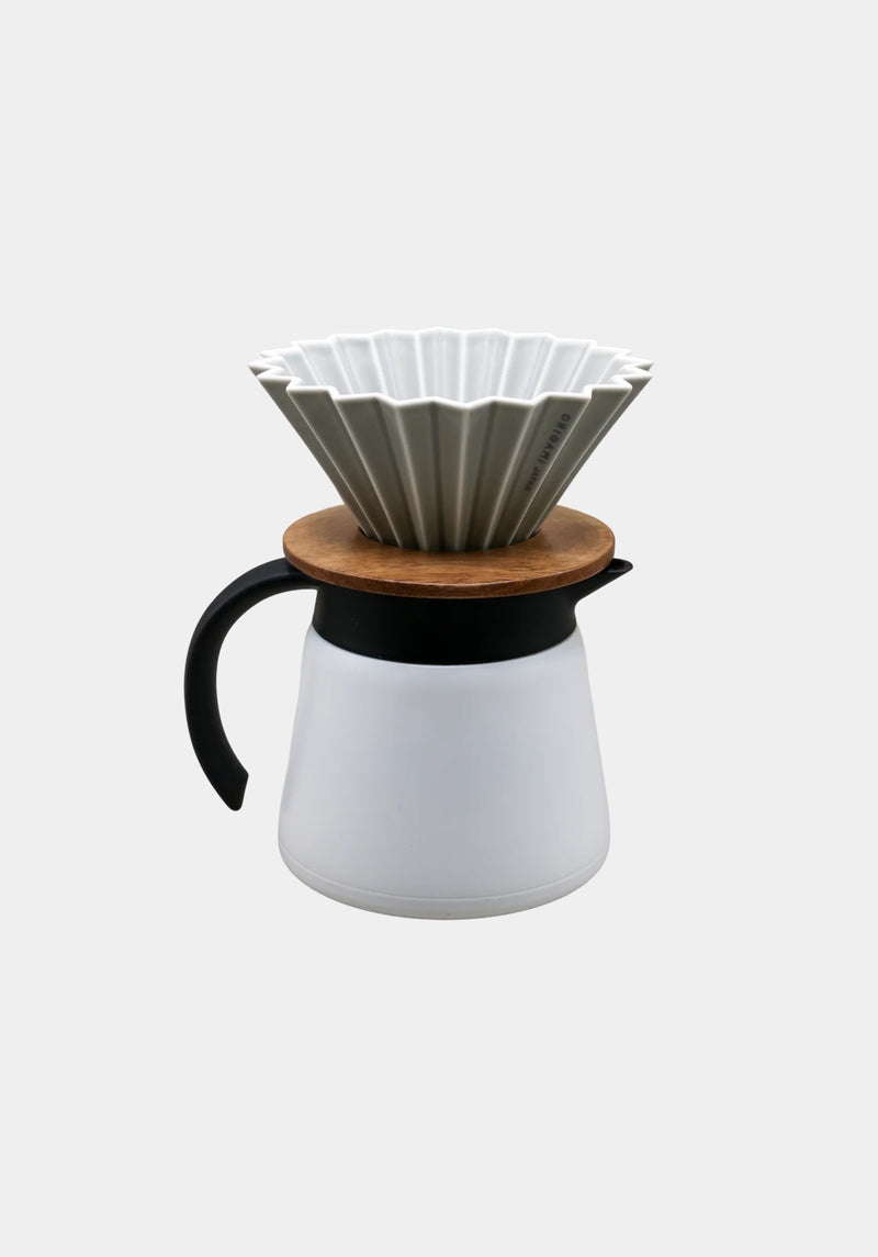 White ceramic coffee maker with wooden ringand black handle on a white background
