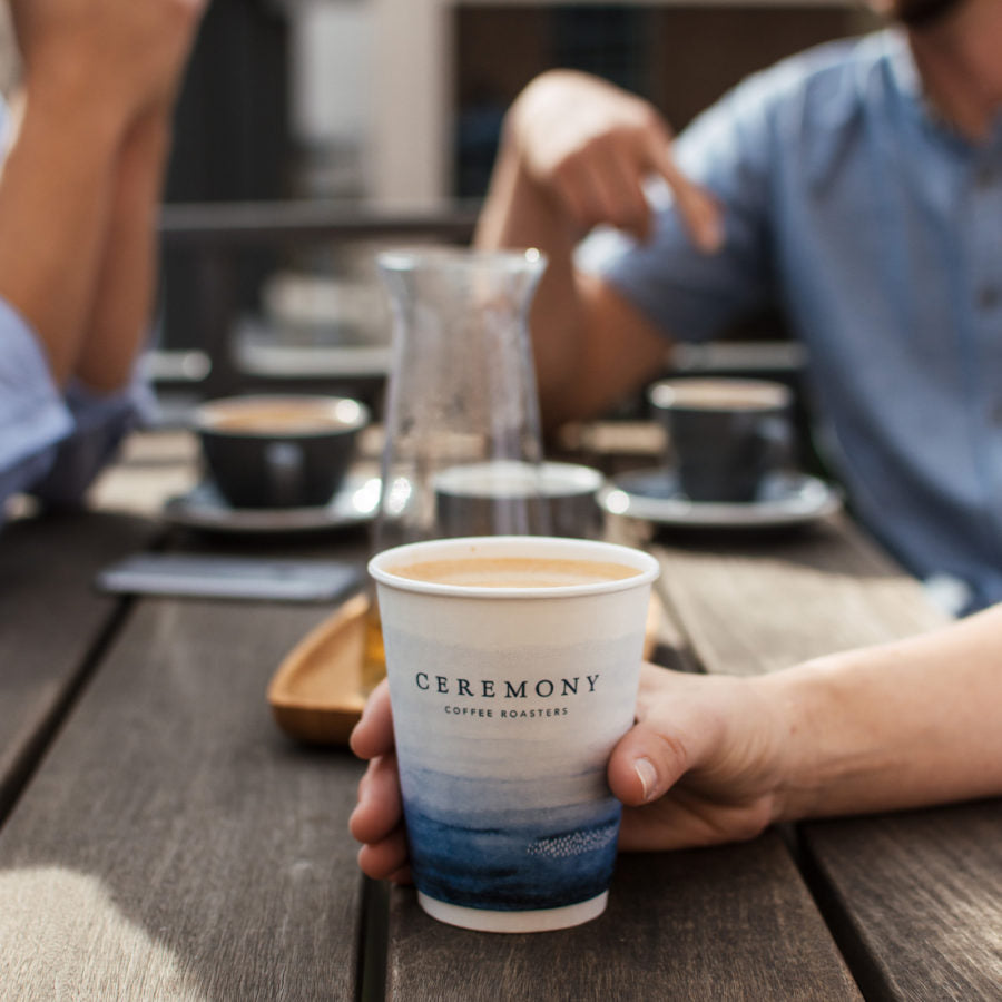 Group having coffee outside.