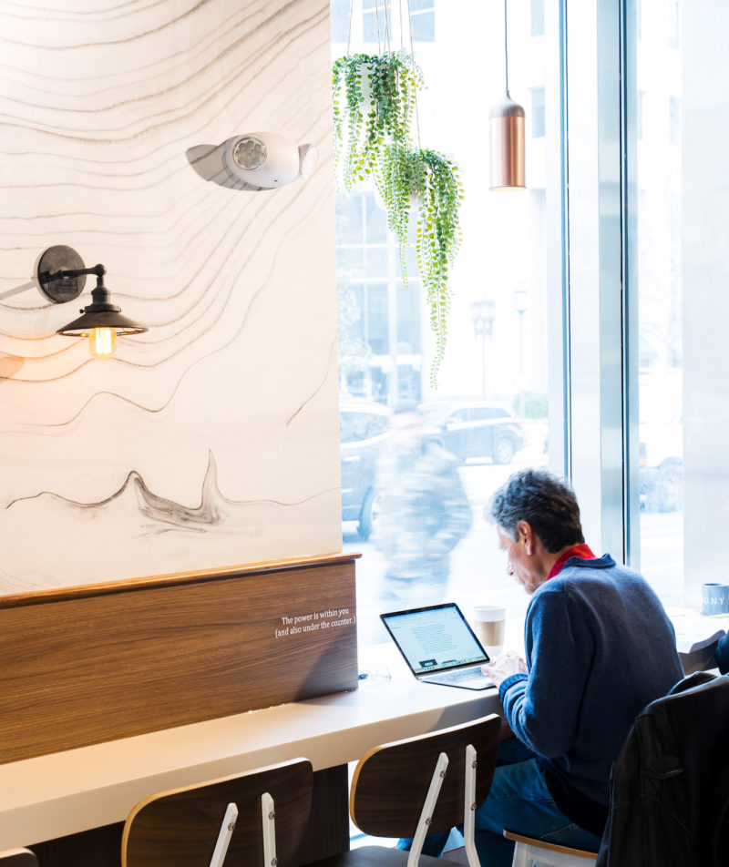 Customer on his laptop at Bethesda location.