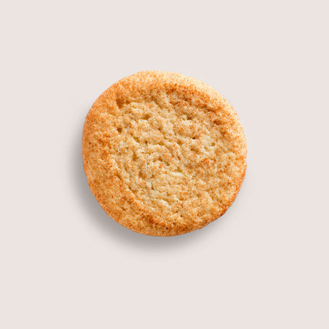 A golden-brown sugar cookie with crispy edges and a tender, crumbly texture shown on a light neutral background for Mass Appeal 10.00% Off Auto renew subscription product