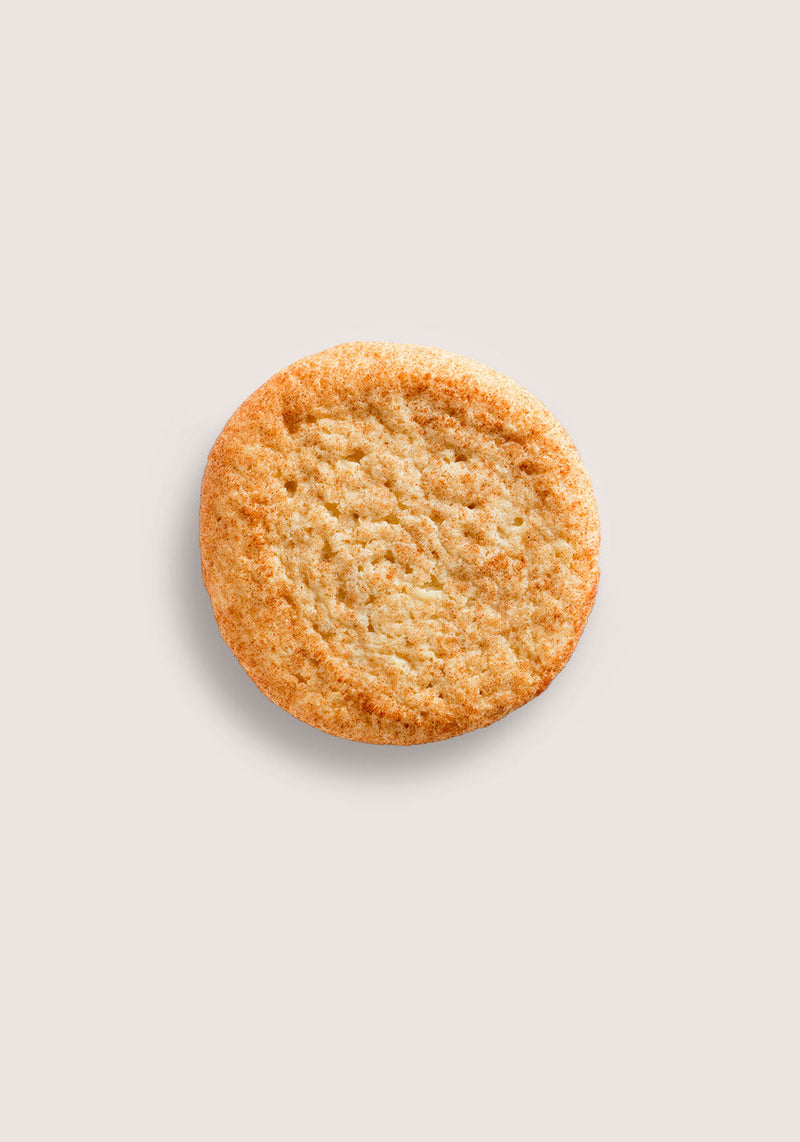 A golden-brown sugar cookie with crispy edges and a tender, crumbly texture shown on a light neutral background for Mass Appeal 10.00% Off Auto renew subscription product