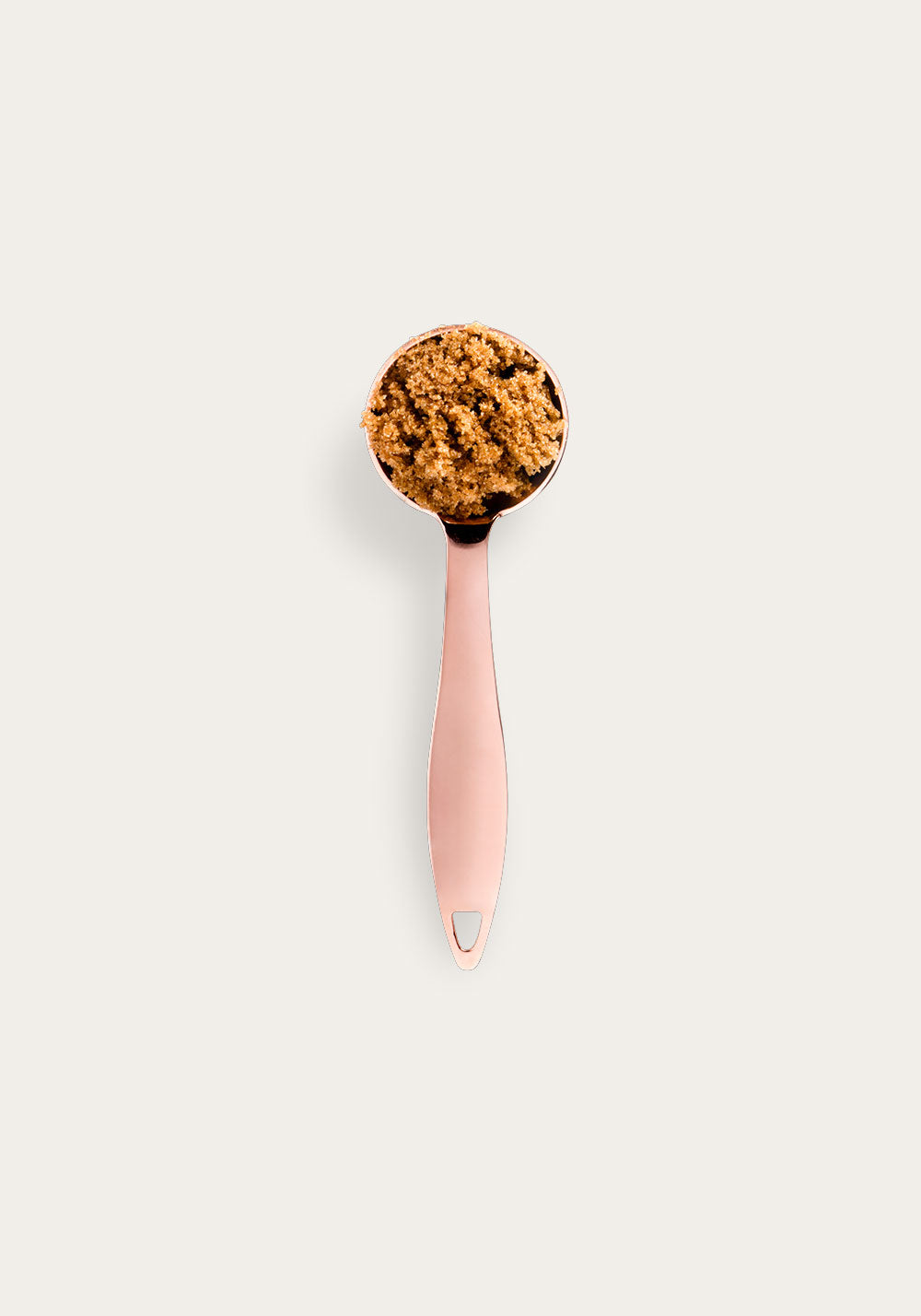 A pink measuring scoop filled with golden-brown Thesis coffee grounds against a cream background, showcasing the 10.00% Off Auto renew subscription product. The scoop features an ergonomic handle and contains finely ground coffee with a rich, textured appearance.
