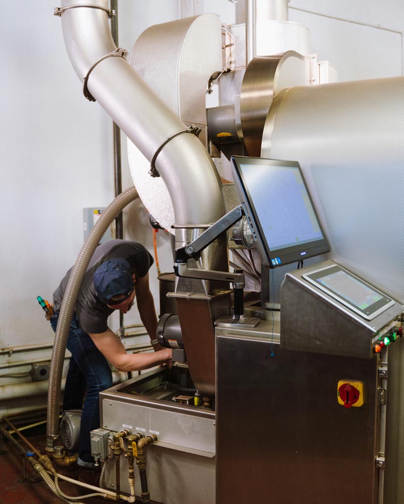 Tech Services Manager repairing parts on Loring S35 Kestrel roaster.