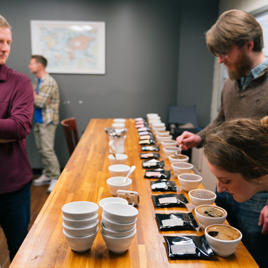 Guests visiting Ceremony's Roastery to smell and taste coffees by cupping method.