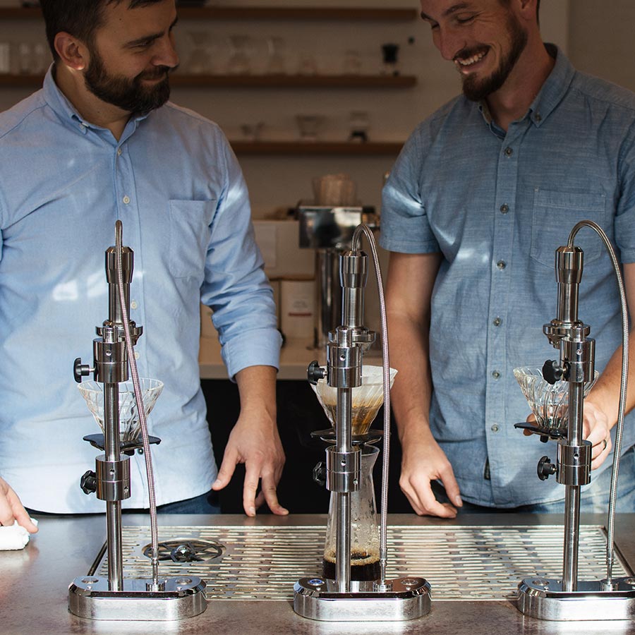 Smiling Ceremony managers brewing a pour-over with a Modbar.